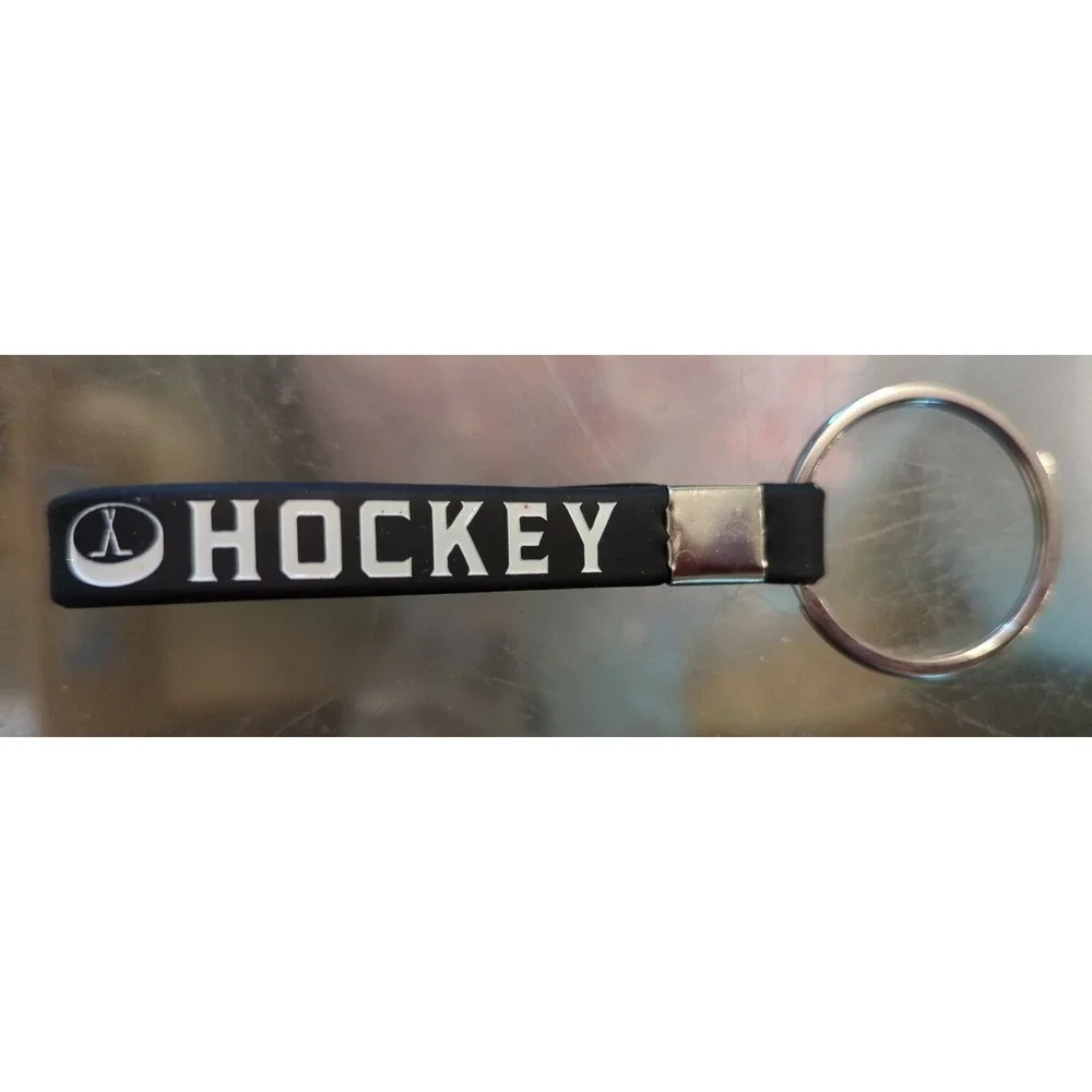 Brand New Inkstone Hockey Winners Never Quit Silicone Rubber Keychain Bracelet